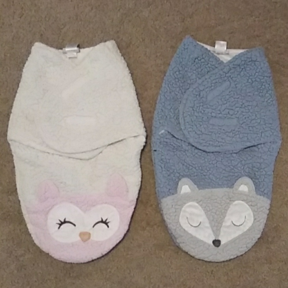 Boy and girl baby swaddles